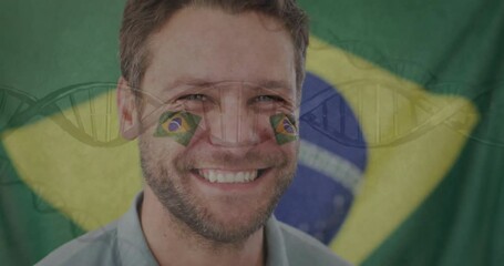 Smiling man with Brazilian flag face paint over DNA strand animation - Powered by Adobe