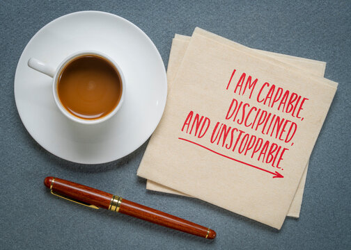 I am capable, disciplined and unstoppable - inspirational positive affirmation on a napkin with coffee