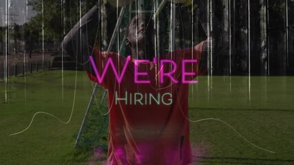 Man playing soccer with We're Hiring text animation over scene