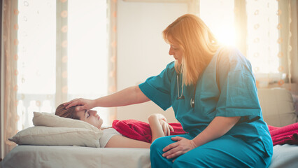 Doctor helping young woman with respiratory problems at home