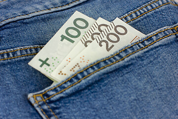 Cash in the jeans pocket.