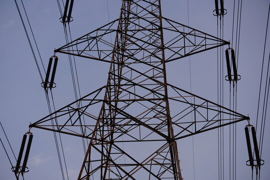 High-Voltage Transmission Tower with Suspended Power Lines and Metal Lattice Structure