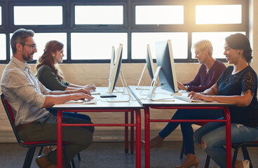 Happy, coworking office and employees at desk, working together and communication on computer....