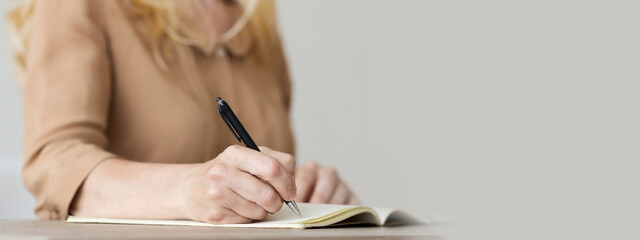 Writer Writing Down Her Ideas For New Book, Focus On Hand, Closeup, copy space