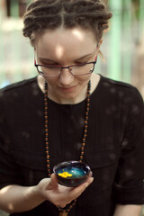 Woman Holding a Teacup for a Traditional Chinese Tea Ceremony