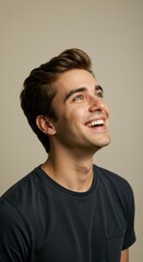 Obraz premium Eye level view, a happy person from the waist up looking up against clean background