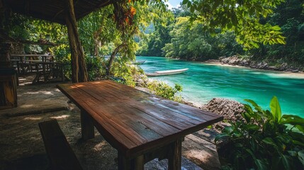Obraz premium Wooden table on a riverside patio, overlooking crystal-clear waters and lush jungle scenery. generative ai