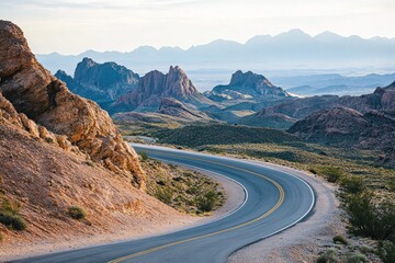 Winding mountain road, desert landscape, scenic view, early morning light