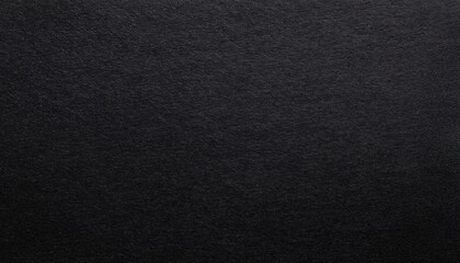 black paper surface with grainy texture