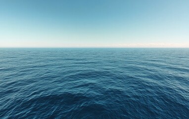 Obraz premium Calm Ocean Water Reflecting a Clear Blue Sky During Midday Near Serene Coastal Location