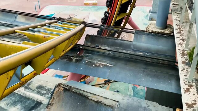 Broken Rollercoaster Track Above Park Scene