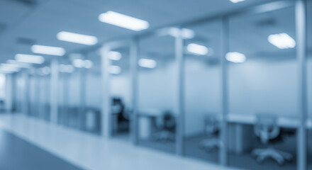 Fototapeta premium Modern Office Interior: Blurred Glass Cubicles & Workspace. Business Ambiance, Corporate Setting, Clean Architecture.