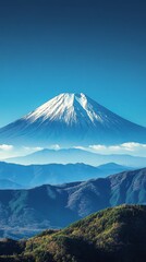 Fototapeta premium Majestic Snow-Capped Mountain Rises Against Clear Blue Sky in Remote Location