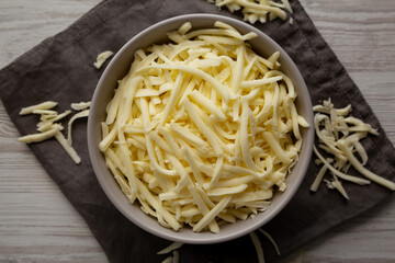 Shredded Mozzarella Cheese in a Bowl, top view.