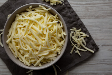 Shredded Mozzarella Cheese in a Bowl, top view.