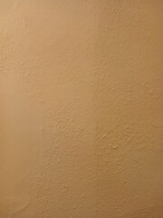Smooth texture in dark sand color. Place for text. Vertical shot
