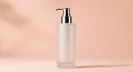 Elegant Frosted Glass Bottle with Dispenser on Soft Peach Background