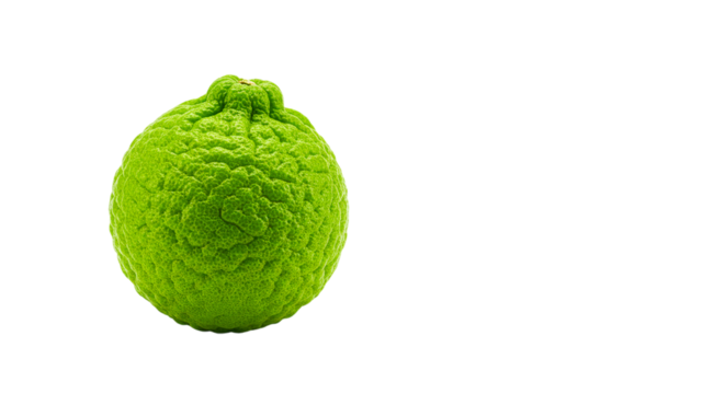 Close up of a bright green citrus fruit with a bumpy rind against a black background space for text