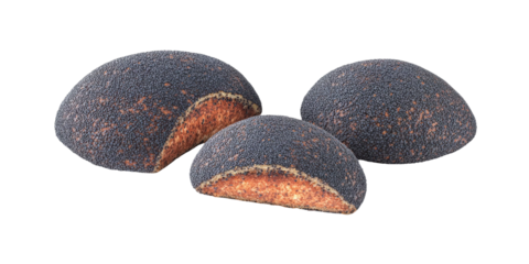 Close-up view of three dark, textured edible seed pods showcasing rich colors and unique shapes on a white background for culinary exploration