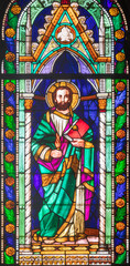 Fototapeta premium FLORENCE, ITALY - MARCH 21, 2025: The St. Jude the Apostle in the stained glass of church Chiesa di San Giuseppino by U. de Matteis (1865).
