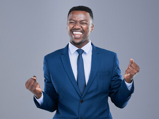 Happy, fist or businessman in studio for celebration, winning or cheer for professional career. Law firm, black person or lawyer with hands for excited, case success or achievement by gray background