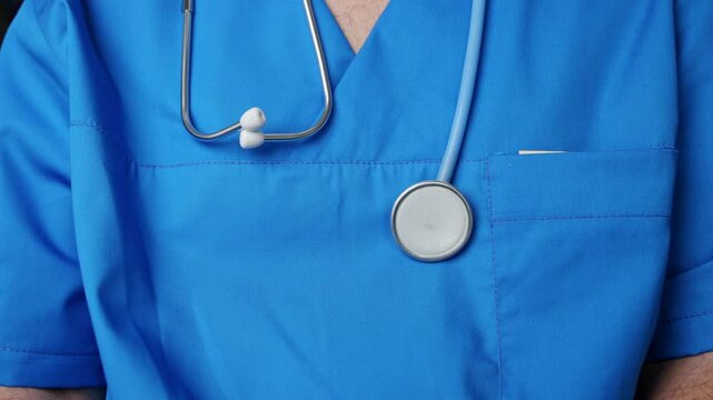 patient giving bribery to doctor. hand putting in pocket some money or putting on the table. corruption problem in medical system, stethoscope close up, medical assistant looking on bancnote.