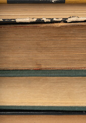 Old book stack pages texture. Vintage books background, antique library collection closeup
