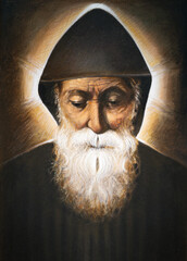 PRATO, ITALY - MARCH 21, 2025: The painting of of Saint Charbel Makhlouf in church Chiesa di San Domenico by Giuseppe Afrune (2018). 