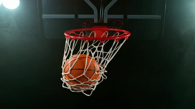 Super slow motion of basketball ball hitting the basket . Filmed on high speed cinema camera , 1000 fps , camera motion