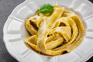 Pappardelle pasta filling main course appetizer vegetable dish fresh gourmet food background on the table rustic food top view copy space