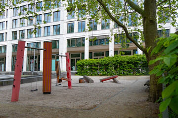 Fototapeta premium Wooden playground equipment, green grass, symbolizing outdoor play and children's recreation, natural materials and outdoor play space