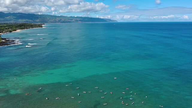 Aerial view of Chun's reef small wave surfing on North Shore of Oahu, Hawaii
