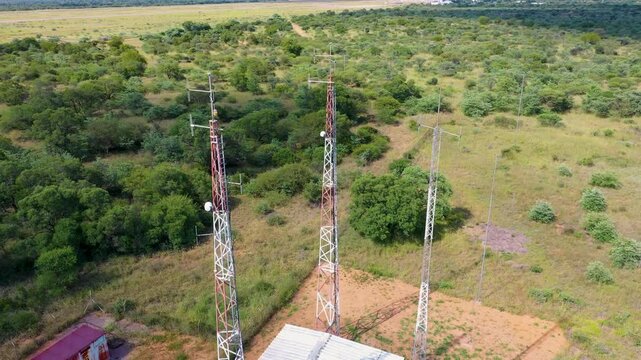 aerial view of array of towers mast antennas station in the African bush