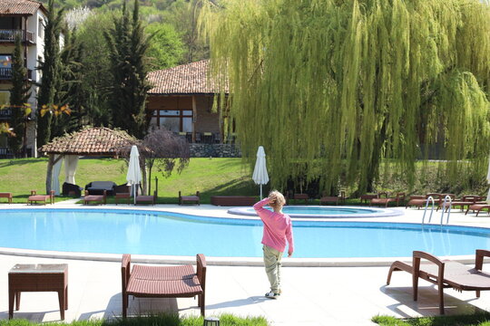boy relaxing in a pool