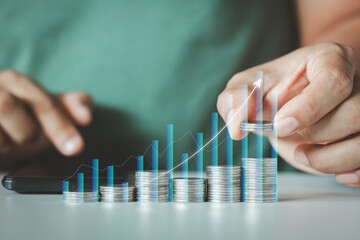 Savings and Investment concept. Saving money for finance accounting to arrange coins into the...