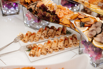 A beautifully arranged dessert table with a variety of sweet and savory treats for guests to enjoy.