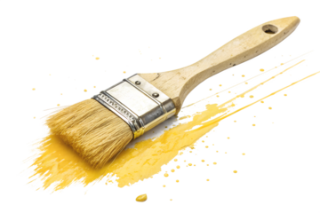Paintbrush with yellow paint splatters on transparent background