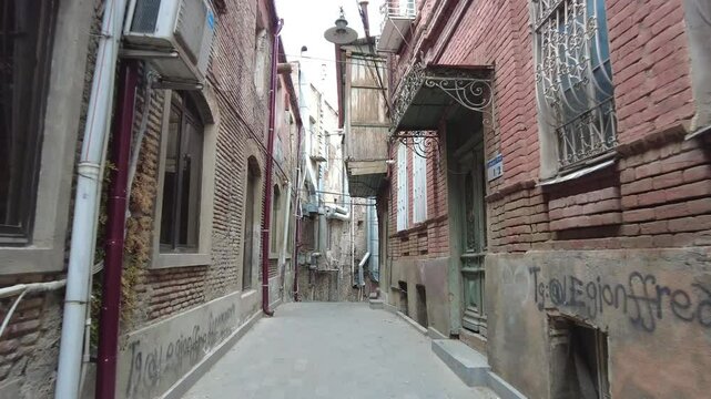 Camera moves ahead on the narrow street in Old Tbilisi