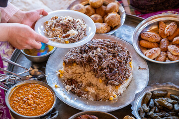 Traditional Turkish food set with Divrigi pilaf and regional dishes on a floor table