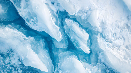 Obraz premium Top-Down Drone View of Icy Glacier Landscape with Dramatic Crevasses and Blue Ice Patterns