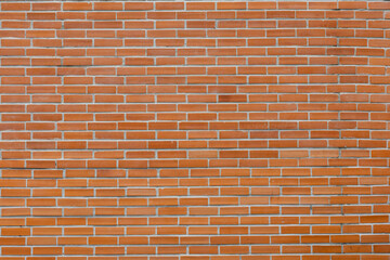 A beautifully textured rustic brick wall, showcasing warm earthy tones and meticulous arrangement, creating a sense of timelessness and architectural elegance in every detail.