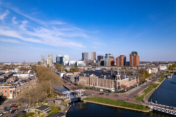 Fototapeta premium High rise buildings of financial office district and urban transportation hub seen from above. Aerial airscape cityscape 