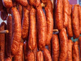 Traditional Cured Sausages Hanging in a Market