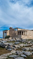 Fototapeta premium ancient ruins with columns and view of the city, stones and the sky