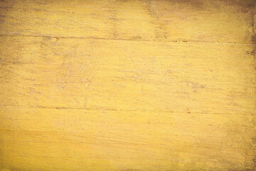 closeup of grunge yellow painted, rough wood background