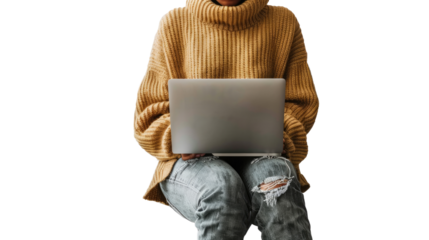 Warm Workspace: A person, clad in a cozy mustard sweater and distressed jeans, focuses intently on their laptop