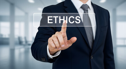 Businessman in Dark Blue Suit Points to Transparent Ethics Button in Bright Office