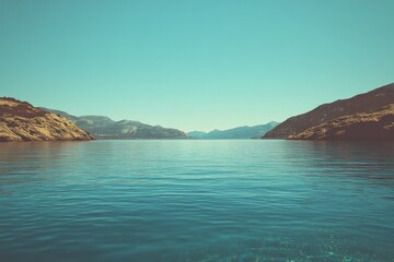 Fototapeta premium Clear turquoise lake surrounded by mountains and blue sky
