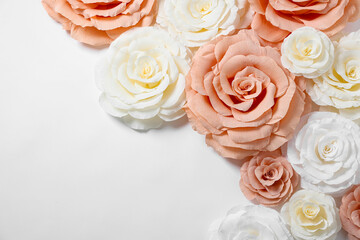 Beautiful paper flowers on white background, flat lay. Space for text