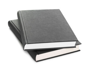 Closed black hardcover books isolated on white